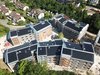 Querschnitt durch das Gelände. Die Tiefgarage liegt unter den Gebäuden D, E und F.